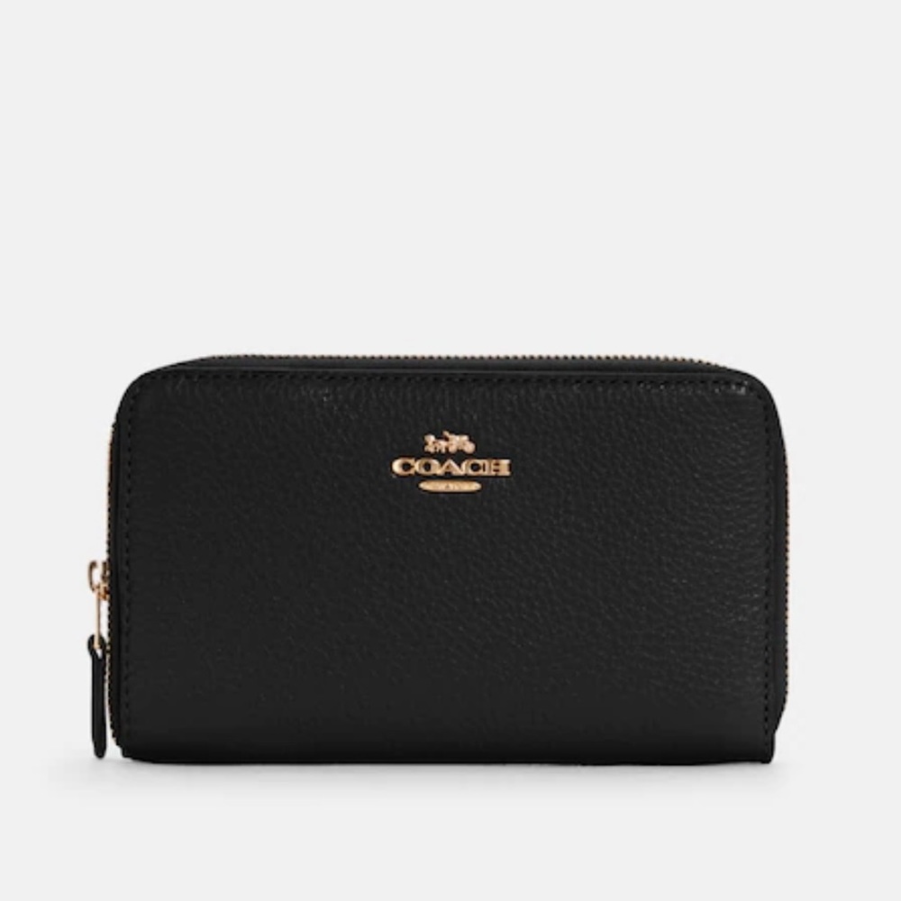 Coach brand wallet, black leather, never been used! Tags and original packaging.